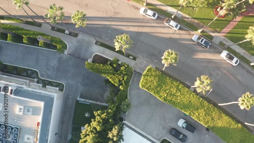 Stunning aerial view of Beverly Hills neighborhood, Beverly Hills Hotel, and Sunset Boulevard surrounded with palm trees in Los Angeles, California.