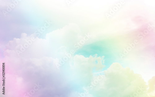 Beautiful white fluffy clouds on bright turquoise and blue pastel sky in a suny day photo