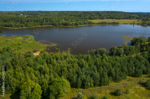Aerial view from above on a forest lake and and its surroundings © Konstantin