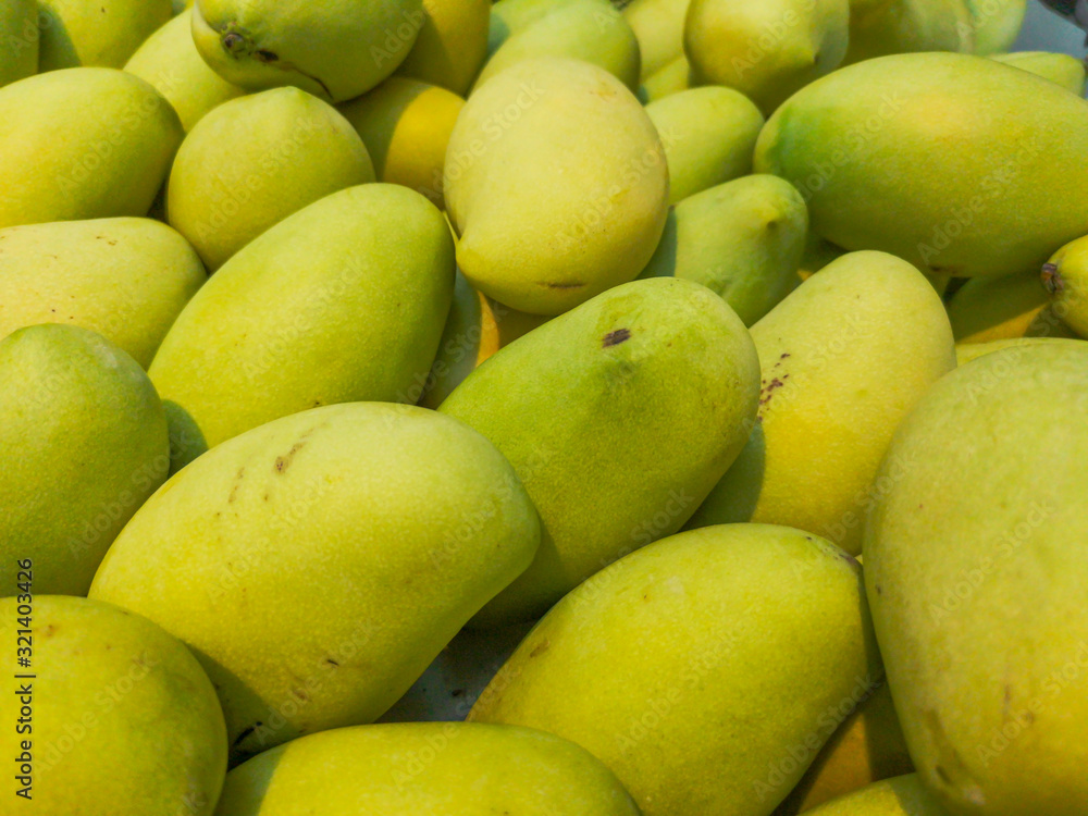 Mango on the market as a background