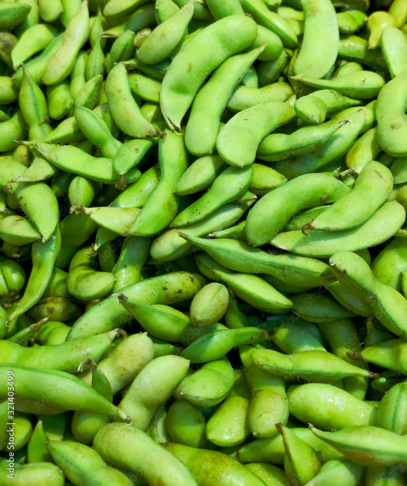 Green beans on the market as a background