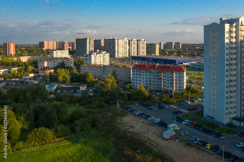 Obraz premium LOBNYA, MOSCOW REGION - AUGUST 31, 2019: Aerial view of the residential buildings of the city of Lobnya. Late bright summer evening