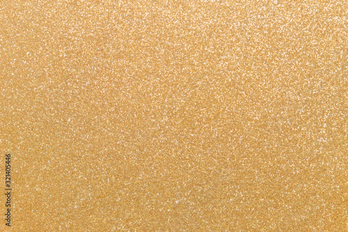 Seamless pattern, golden glitter background. Sparkling flat lay with copy space for your projects. Trendy gold backdrop