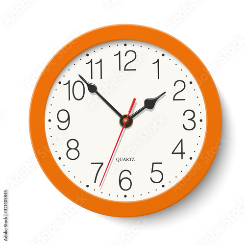 Round wall clock with orange color body isolated on white background