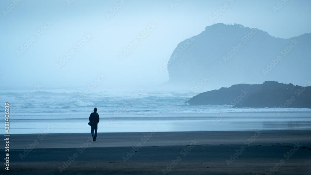Walking on the Piha beach in the morning mist