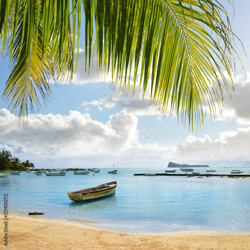 Boats on the sea in Cap Malheureux, Mauritius island, Indian Ocean.