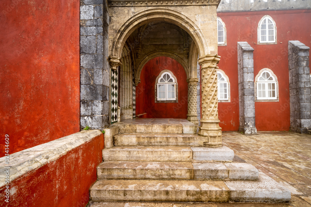 Extremely heavy, thick fog at the colorful Pena Palace in the winter, steps and intricate doorways in photo Extremely heavy, thick fog at the colorful Pena Palace in the winter, steps and intricate doorways in photo