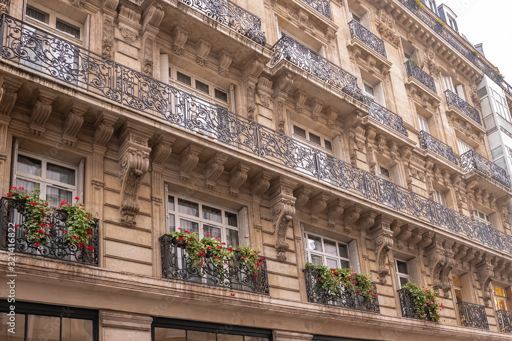 Paris, typical facade and windows, beautiful building in the Marais
