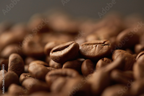 Roasted coffee beans close up. Espresso dark, aroma, black caffeine drink