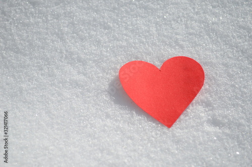 Happy Valentine's Day red hearts close up on snow
