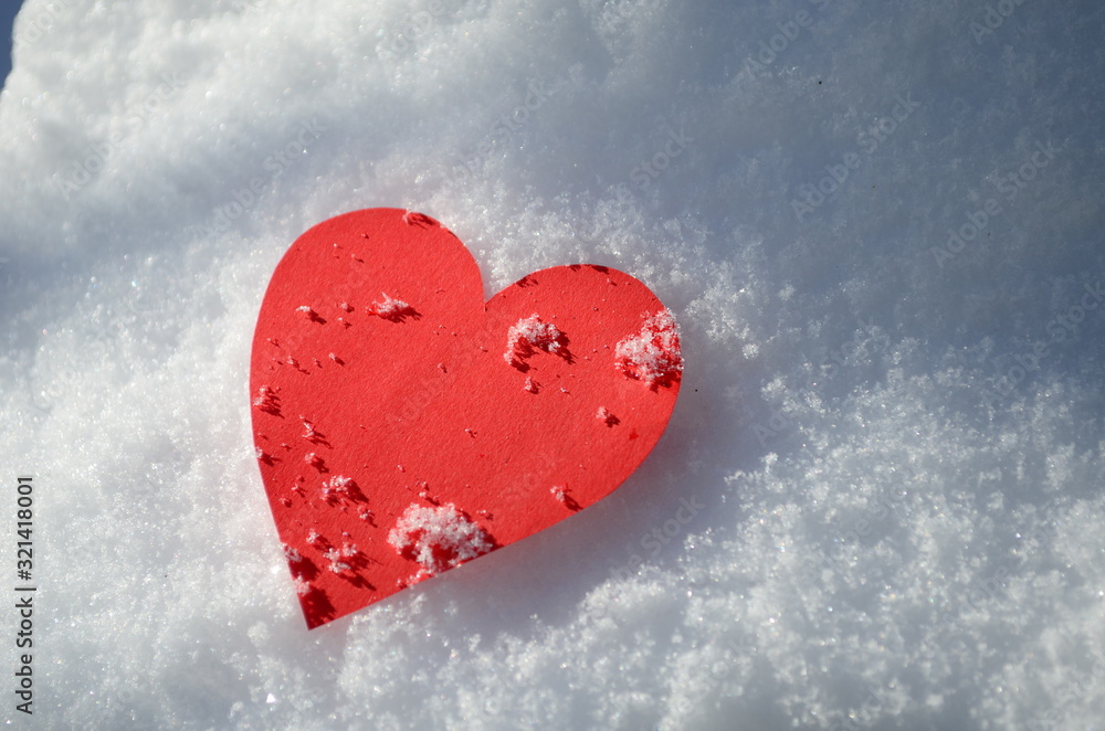 Fototapeta premium Happy Valentine's Day red hearts close up on snow