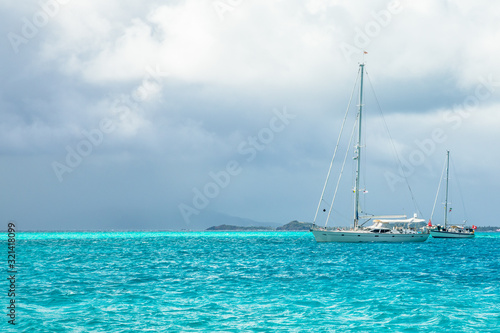 Turquoise sea and anchored yachts, Tobago Cays, Saint Vincent and the Grenadines, Caribbean sea