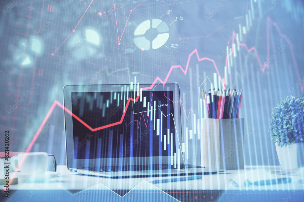 Stock market chart hologram drawn on personal computer background. Double exposure. Concept of investment. Stock market chart hologram drawn on personal computer background. Double exposure. Concept of investment.