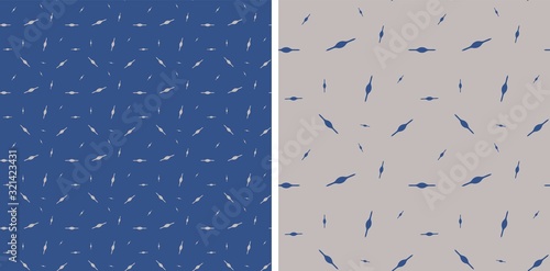 Abstract vector seamless pattern of blue and gray dashes. Extension cord in the middle of a stick. Two blue, gray backgrounds. Chaotic arrangement of elements for fabric, wallpaper, website, magazine