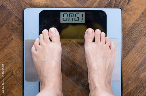 Female feet on weight scale