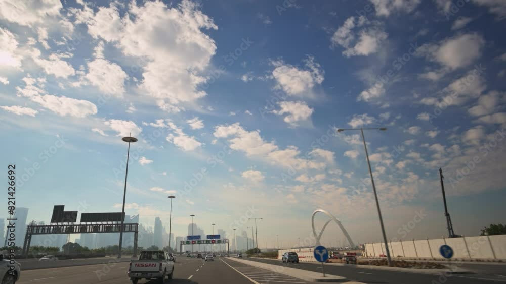 Smooth drive on wide road towards West Bay business center in Doha, Qatar. Skyline in the background. Smooth drive on wide road towards West Bay business center in Doha, Qatar. Skyline in the background.