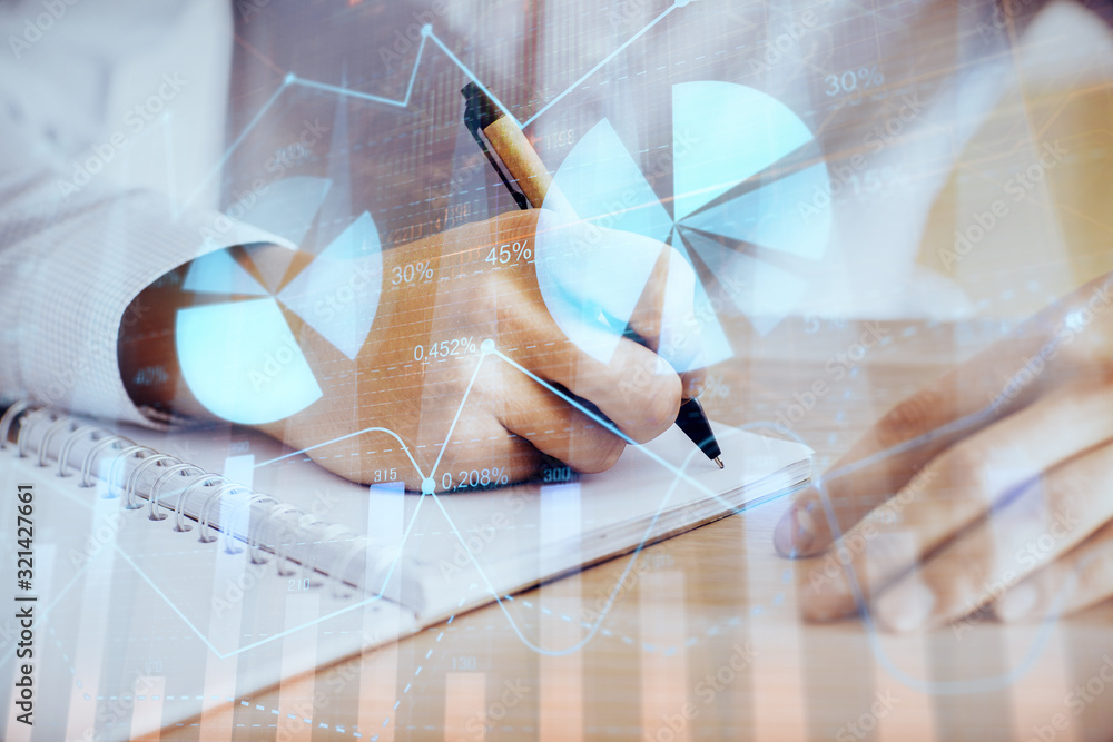 Multi exposure of man planing investment with stock market forex chart. Multi exposure of man planing investment with stock market forex chart.