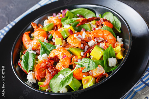 shrimp avocado spinach salad in a bowl