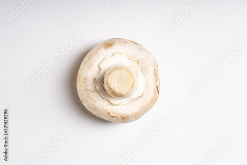 top view on fresh tasty champignon isolated on white background, healthy organic ingredient for making dishes and different salads. Food, organic and natural vegetables concept