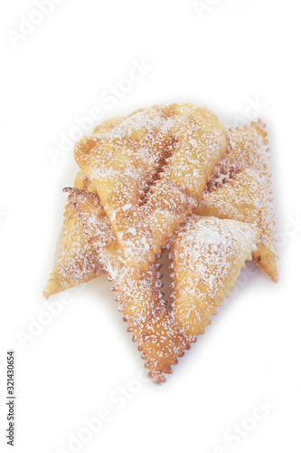 Italian carnival pastry on white. Traditional carnival pastry, chiacchere or crostoli, bugie, cenci isolated on white background photo