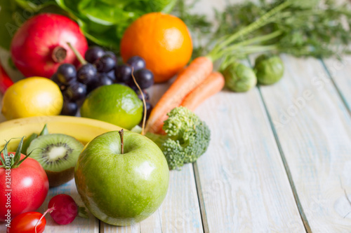 Composition still life fresh fruits and vegetables on wooden board healthy diet lifestyle concept