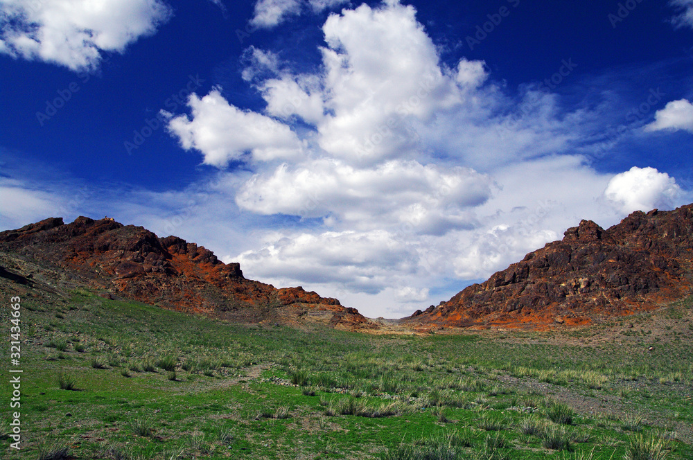 blue sky and white clouds over the vast Mongolian steppes blue sky and white clouds over the vast Mongolian steppes
