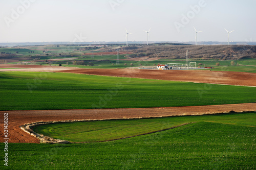 Wind power plant and wind turbines in the background of the image