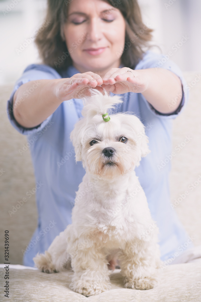 Woman practicing reiki therapy Woman practicing reiki therapy