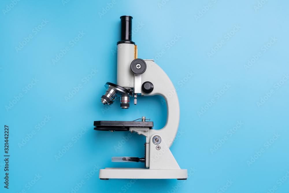 Microscope biology and chemistry subject on the desk from top view