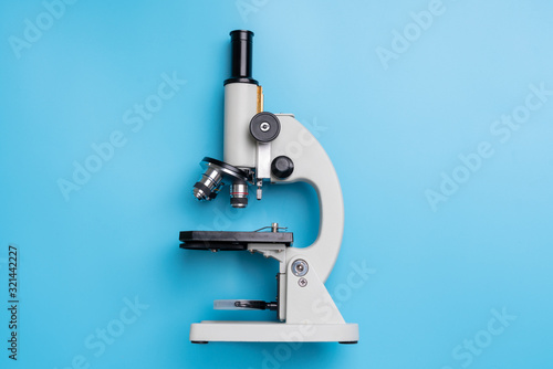 Microscope biology and chemistry subject on the desk from top view photo