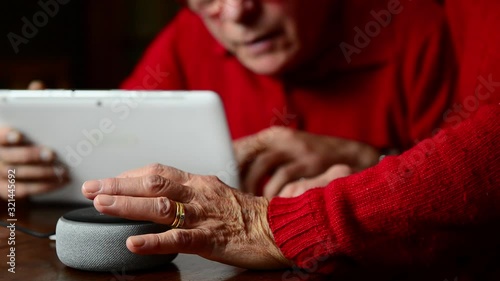 FLORENCE-ITALY, 2020.20.01-Elder caucasian couple connect smart home assistant