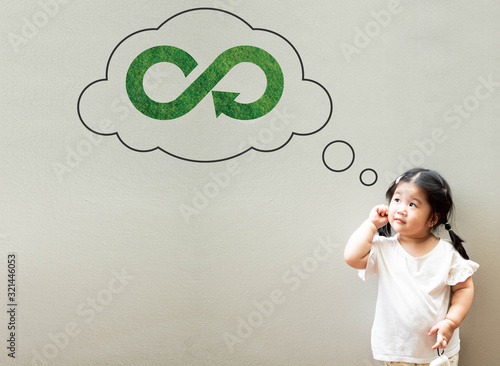 A little girl is thinking about circular economy