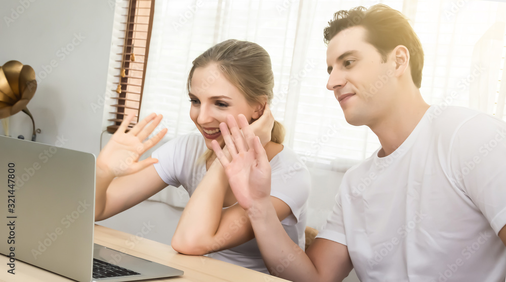 Fototapeta premium Young couple use computers for communication