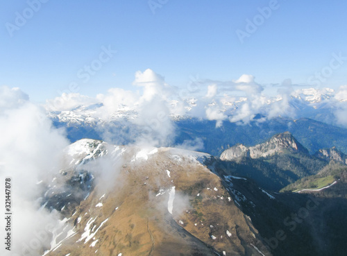 Mountain landscape with a cloud. View from the top.
