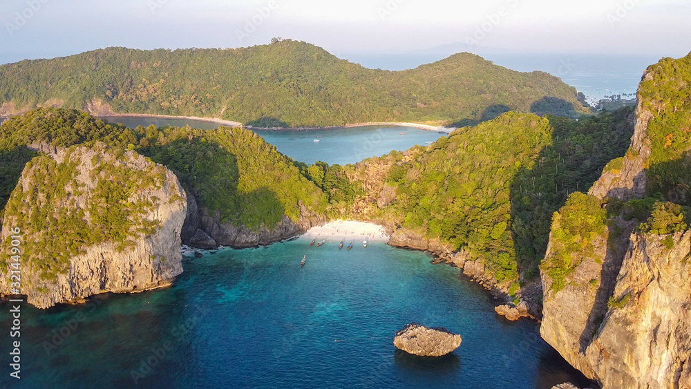 Amazing sunset aerial view of Nui Beach from drone. Ko Phi Phi Don, Thailand
