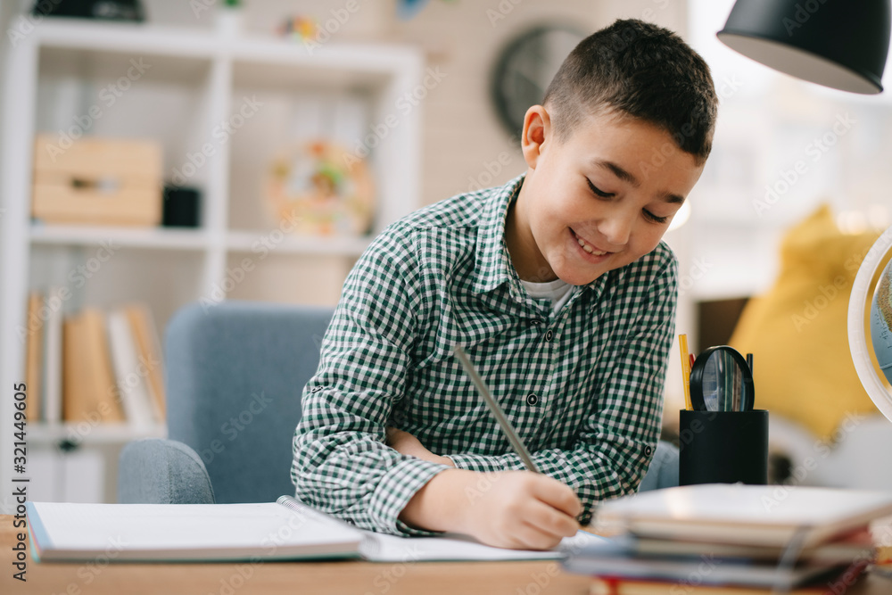 Cute little boy doing homework. Child learning foe school. Cute little boy doing homework. Child learning foe school.