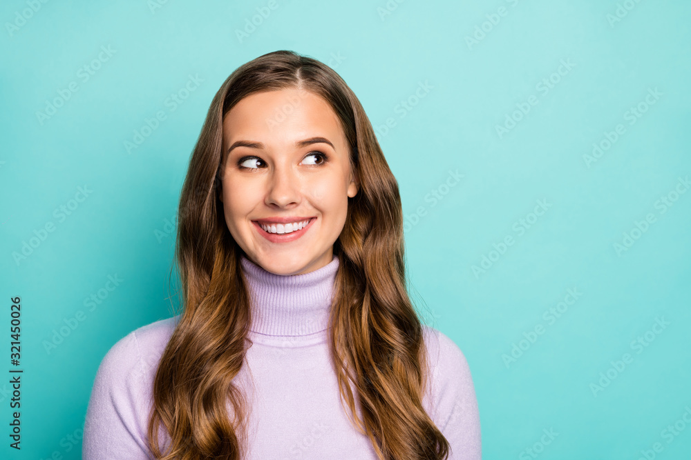 Closeup photo of beautiful pretty lady long wavy hairdo positive mood looking side empty space cunning wear lilac purple pullover isolated teal blue pastel color background - obrazy, fototapety, plakaty 