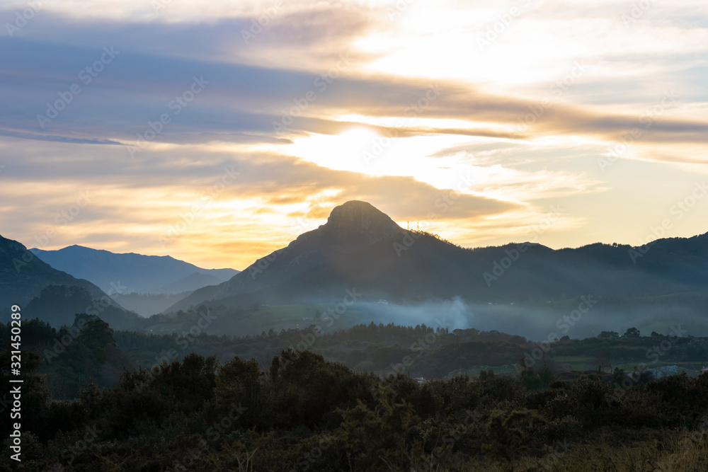 Mountain silhouette landscape at beautiful sunset, Picos de Europa region, in Principado de Asturias, northern Spain.