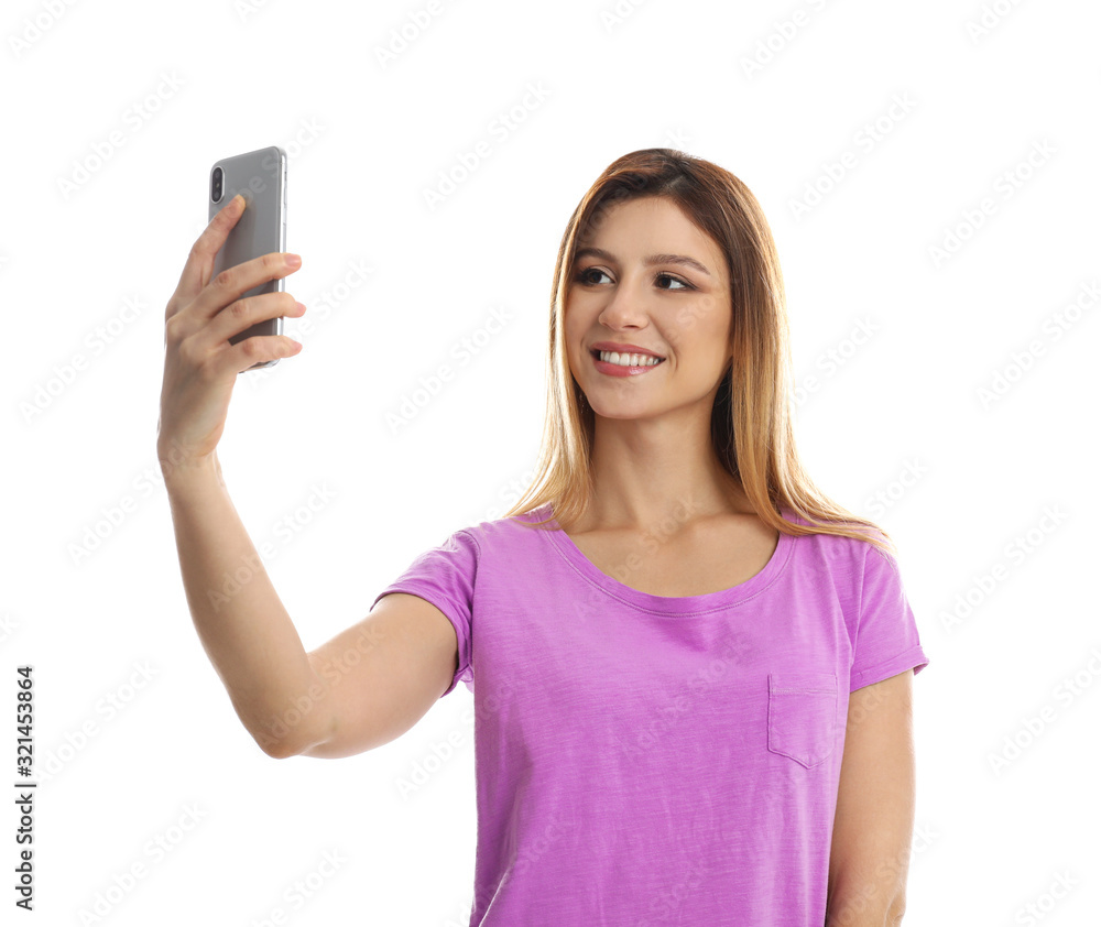 Young woman taking selfie on white background Young woman taking selfie on white background