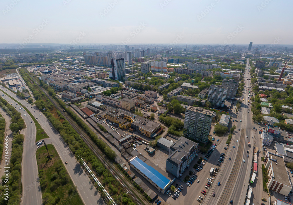 Fototapeta premium Industrial area and Malysheva street in Yekaterinburg city, Russia. Aerial, summer, sunny