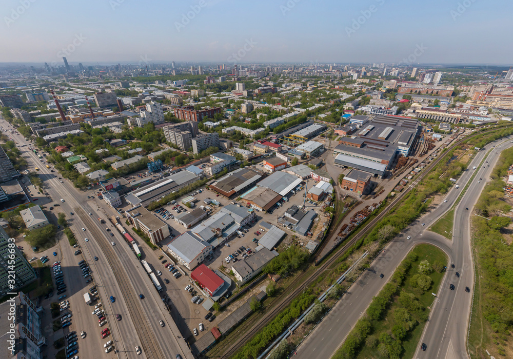 Industrial area and Malysheva street in Yekaterinburg city, Russia. Aerial, summer, sunny