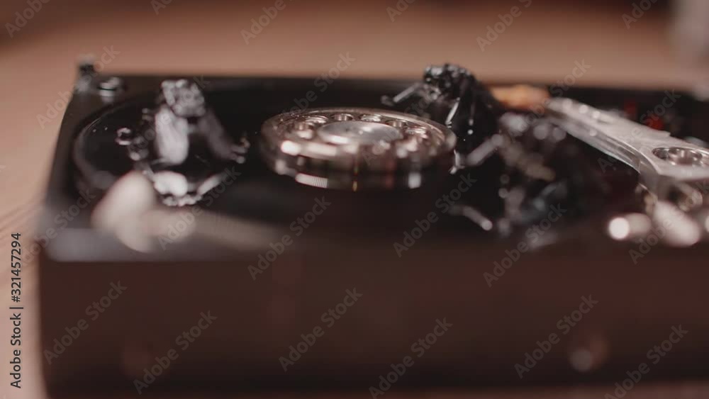Spin disc in hard drive on which sit flies and bugs. Slowmo macro. Soft focus Spin disc in hard drive on which sit flies and bugs. Slowmo macro. Soft focus