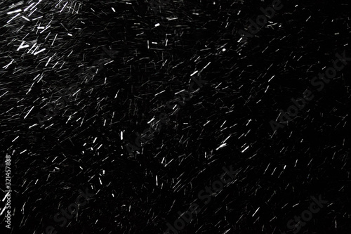Texture of falling snow at night