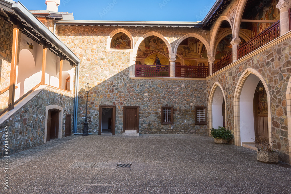Courtyard of famous orthodox Kykkos monastery, Holy Monastery of the Virgin of Kykkos, Cyprus. Beautiful architectural landmark on a sunny day, religious and travel background