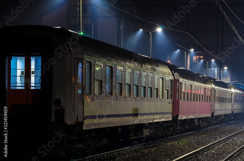 RAILWAY - Railroad cars at station in the rain