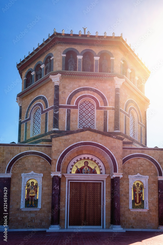 Obraz premium Orthodox church at the hill Panayia Sto Throni over the famous Kykkos monastery, Cyprus. Beautiful architectural landmark on a sunny day, pilgrimage and travel background, vertical image
