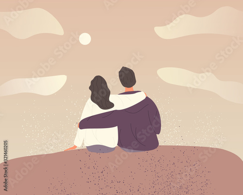 Young couple in love on sky background with clouds. A couple hugging and sitting on a mountain slope. 