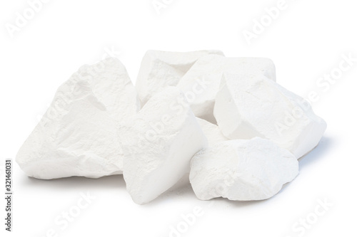 Piece of chalk isolated on white. Pure soft whitish calcite. White, sawn, natural mined chalk, environmentally friendly product. Tasty pica