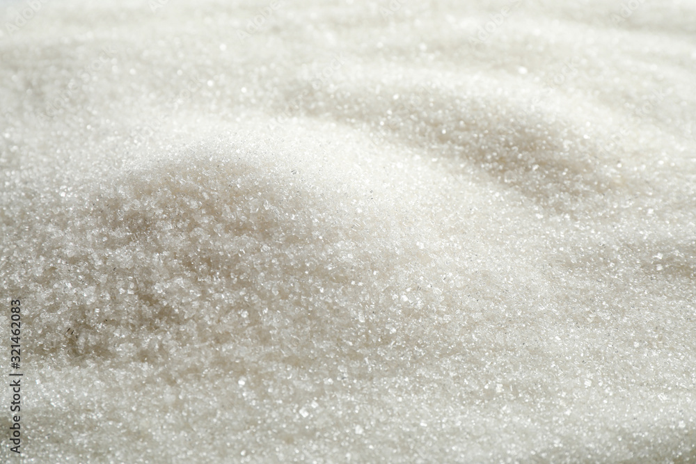 Pile of granulated sugar as background, closeup