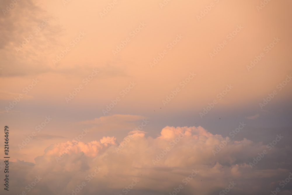 Beautiful pink-golden sunset on the cloudy sky of central Russia.